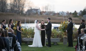 couple getting married outside with beautiful sunflowers