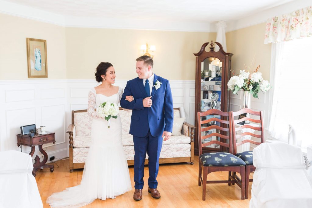 couple smiling as they link arms