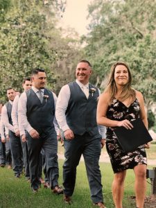 officiant and bridal party walking down the aisle