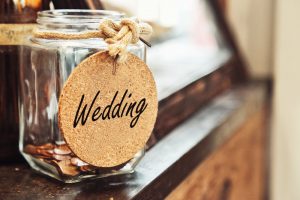 jar with coins labeled wedding