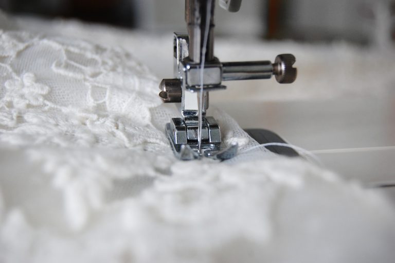 wedding dress under altering machine