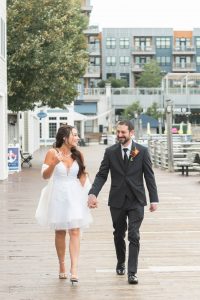 Megan and John walking together holding hands