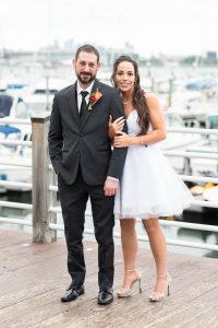 Megan and John smiling as a new couple on their wedding day