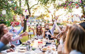 newlyweds celebrating at outdoor dinner party